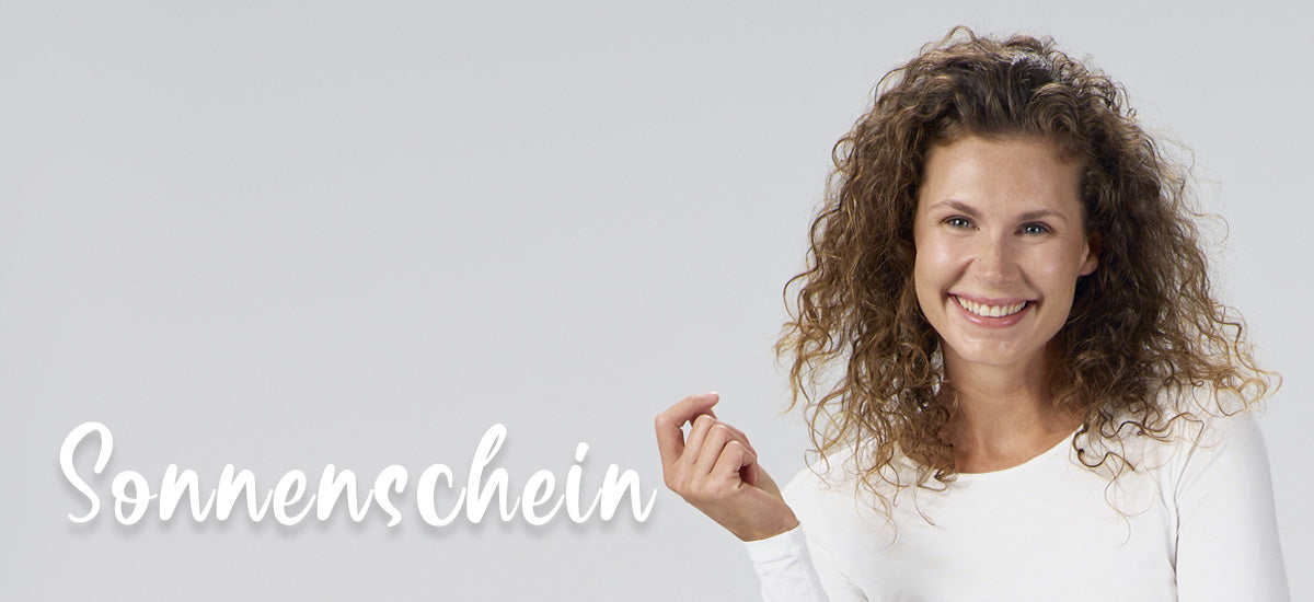 Frau lächelt in die Kamera, daneben steht das Wort Sonnenschein