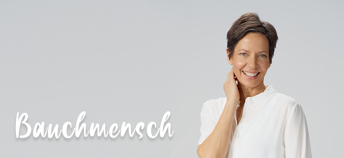 Frau lacht in die Kamera, daneben steht das Wort Bauchmensch
